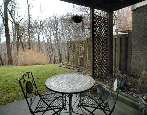 224 Falls Village Road Plum, PA 15239 - Photo 17 of 18 View. Serene wooded sitting area on the patio off the game room.