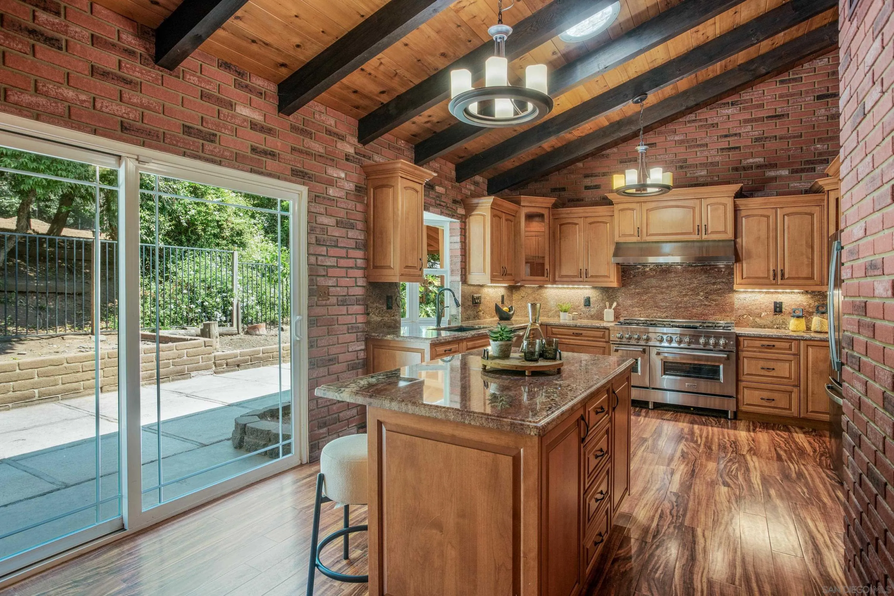 16355 Orchard Bend Road Poway, CA 92064 - Photo 12 of 49 a kitchen with granite countertop a stove a sink and a refrigerator