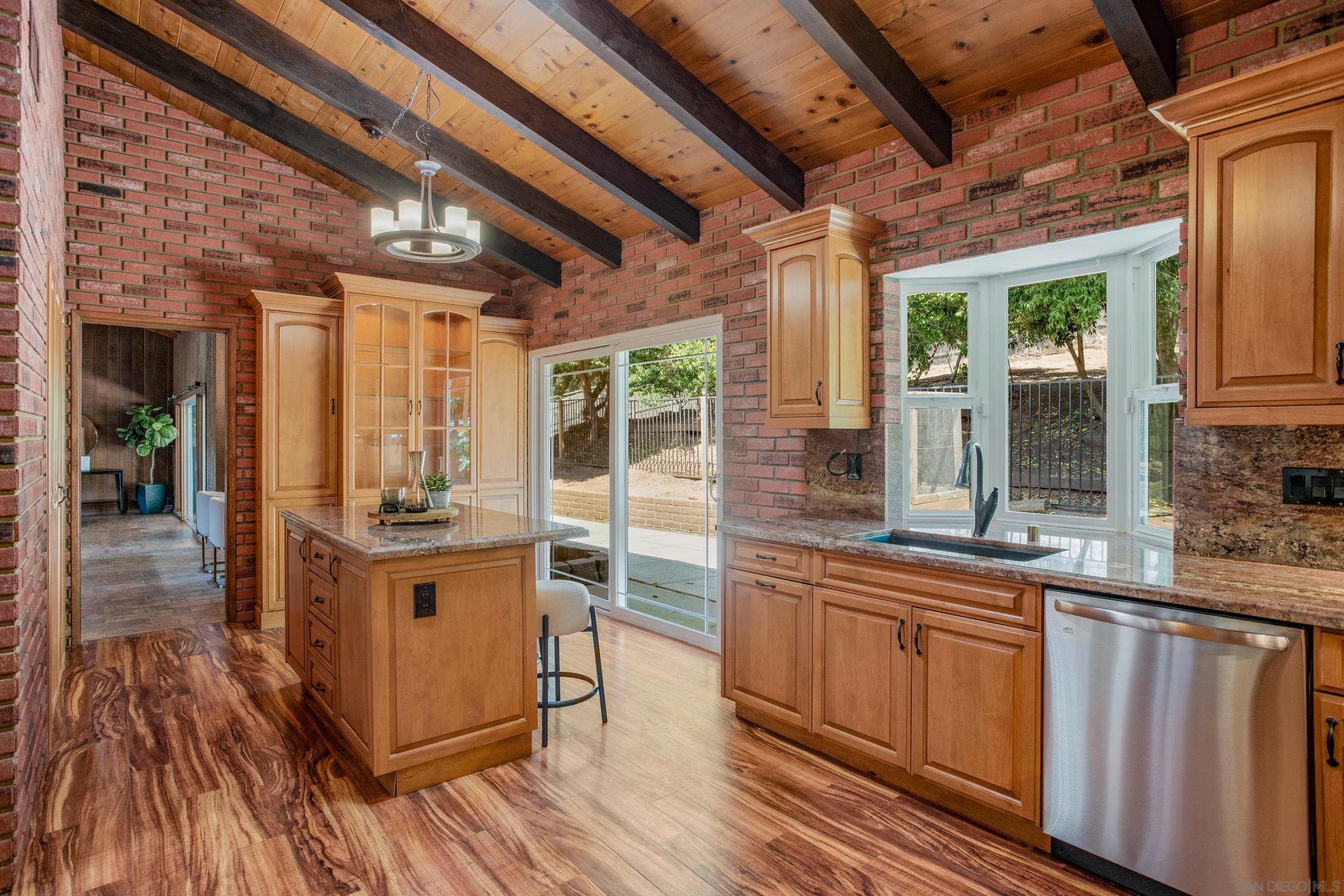 16355 Orchard Bend Road Poway, CA 92064 - Photo 14 of 49 a kitchen with stainless steel appliances granite countertop a stove a sink and a refrigerator