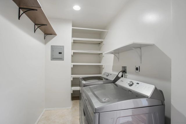a utility room with washer and dryer