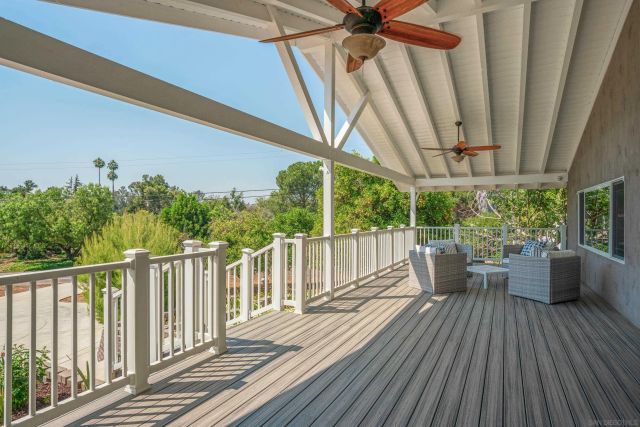a view of a two chairs on the roof deck
