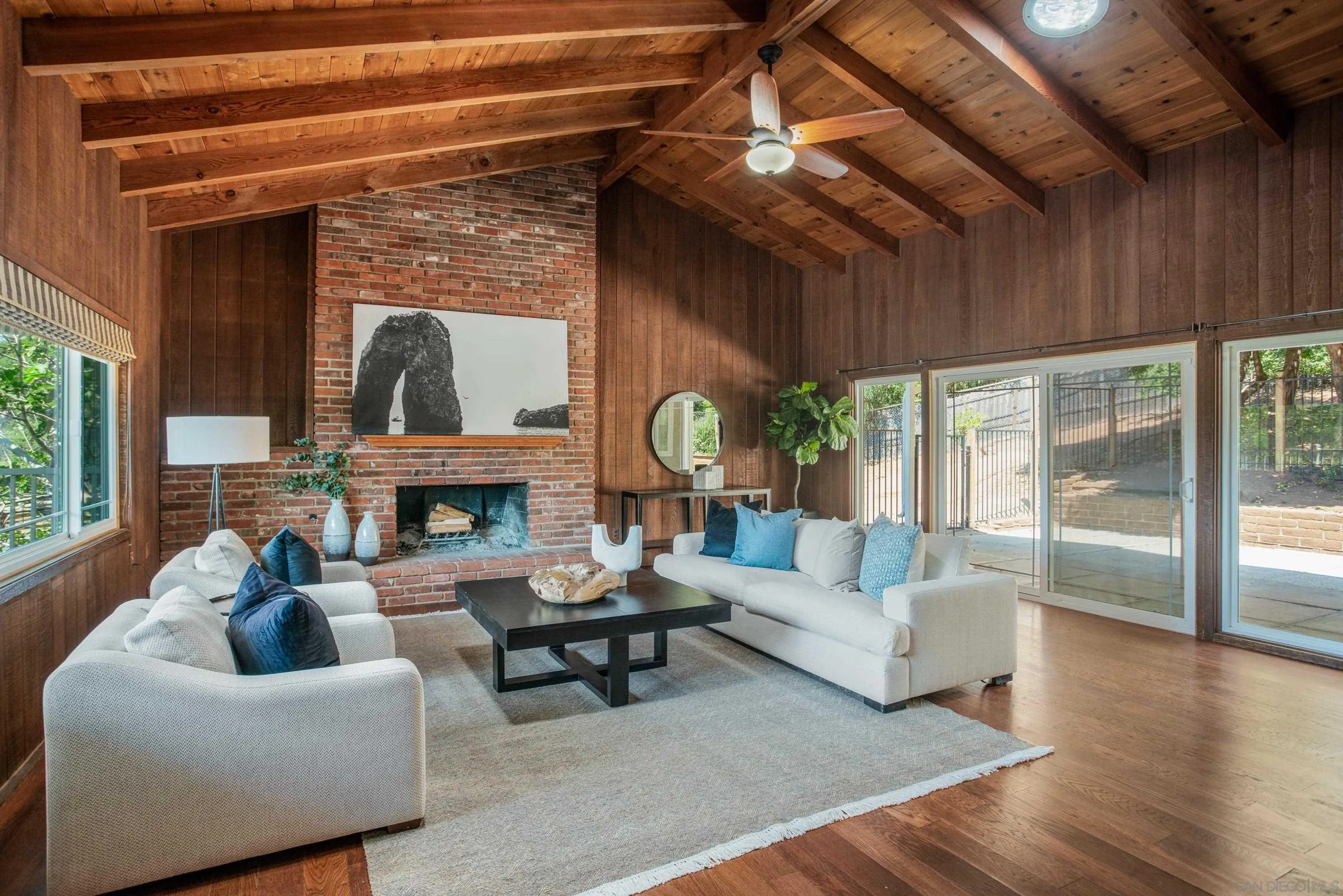 16355 Orchard Bend Road Poway, CA 92064 - Photo 4 of 49 a living room with furniture a fireplace and a large window
