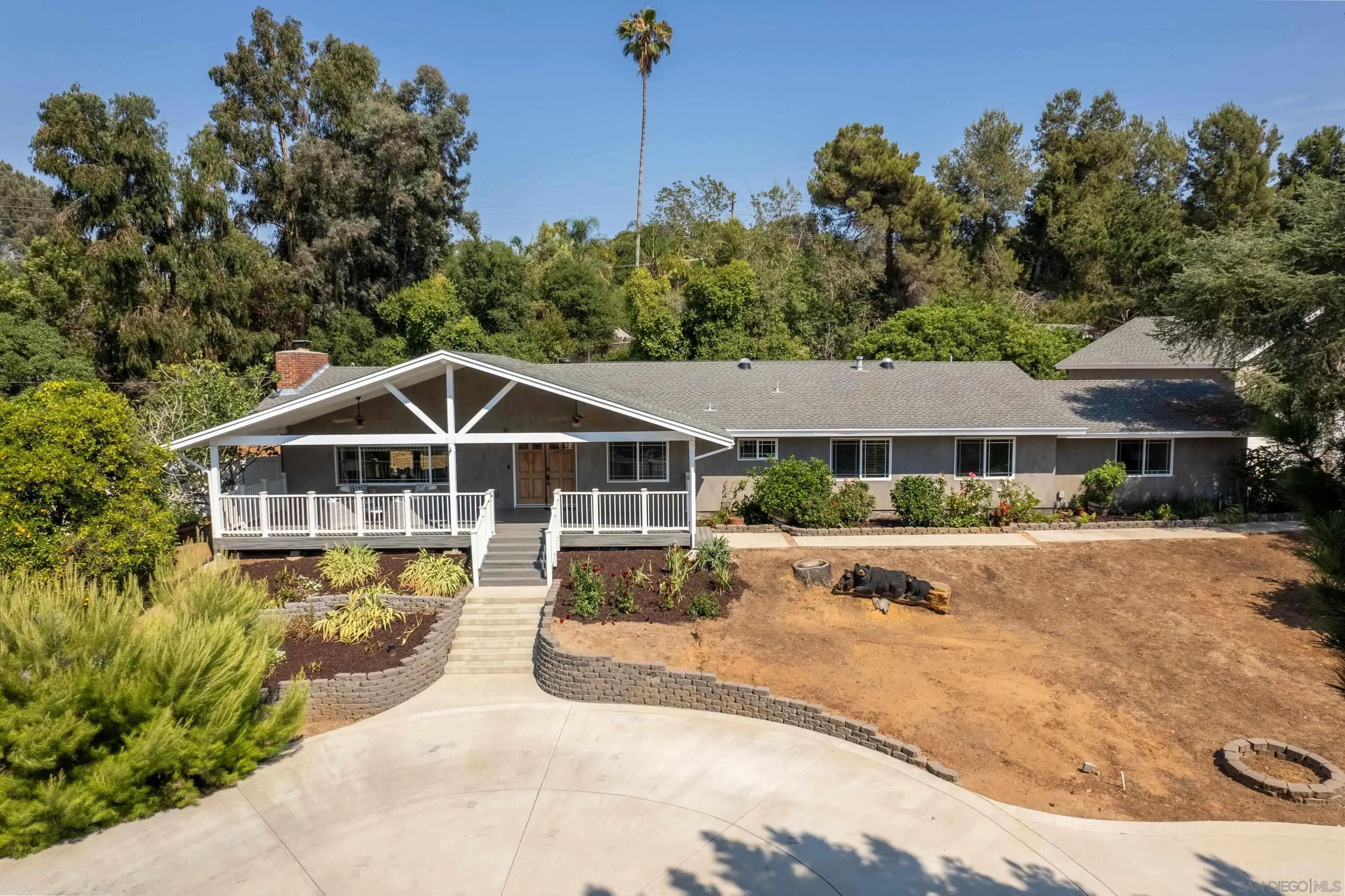 16355 Orchard Bend Road Poway, CA 92064 - Photo 43 of 49 a front view of a house with a garden