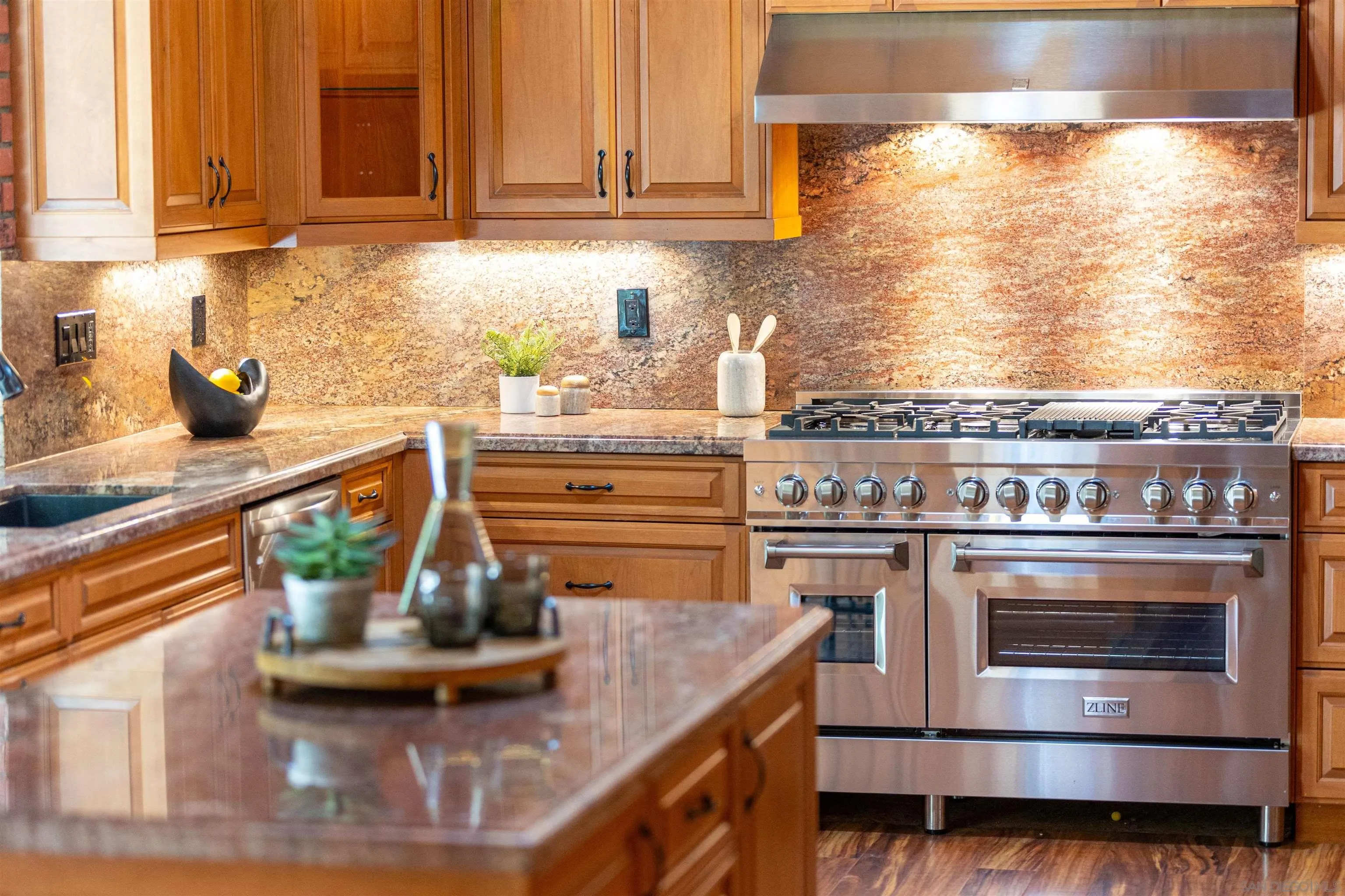 16355 Orchard Bend Road Poway, CA 92064 - Photo 7 of 49 a kitchen with stainless steel appliances granite countertop a stove and a sink