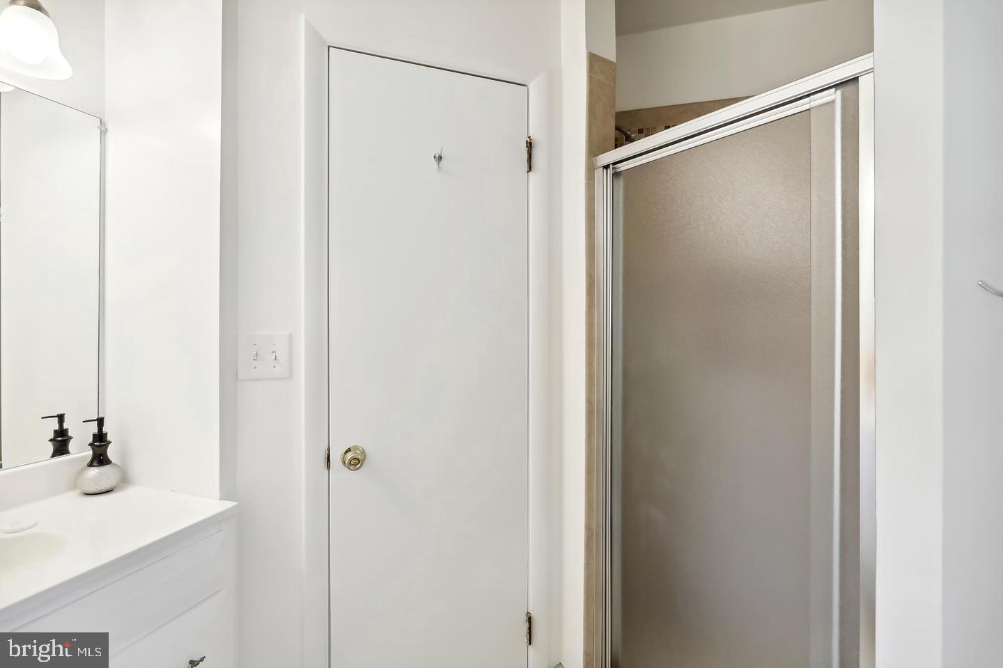 1702 Franwall Avenue Silver Spring, MD 20902 - Photo 11 of 17 a bathroom with a shower and a sink