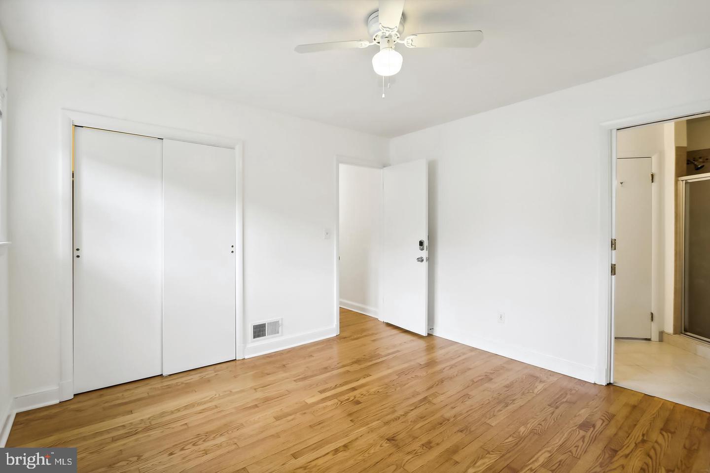 1702 Franwall Avenue Silver Spring, MD 20902 - Photo 7 of 17 a view of an empty room with wooden floor