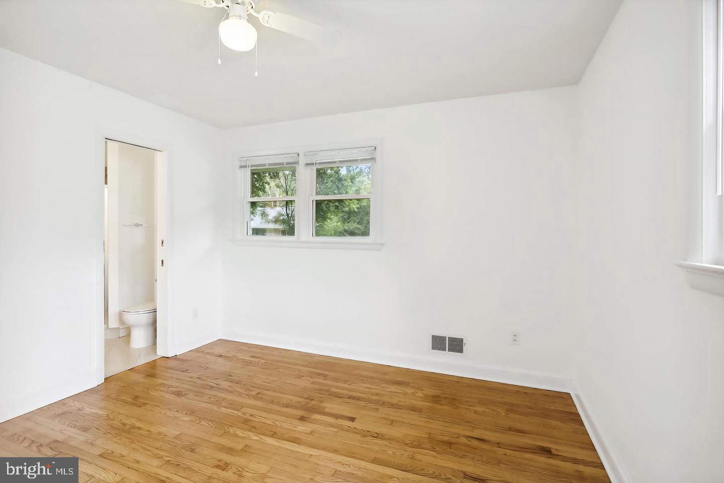 1702 Franwall Avenue Silver Spring, MD 20902 - Photo 9 of 17 a view of empty room with wooden floor