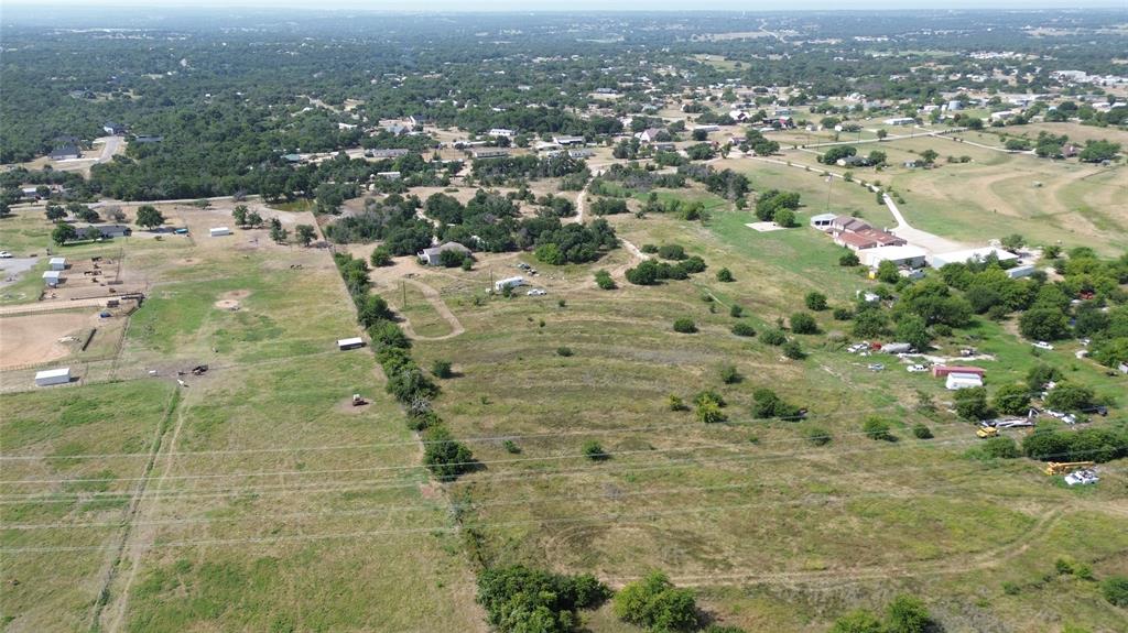 601 Green Branch Road Weatherford, TX 76085 - Photo 6 of 8 Expansive rural acreage featuring varied topography, mature trees, open fields, and multiple outbuildings