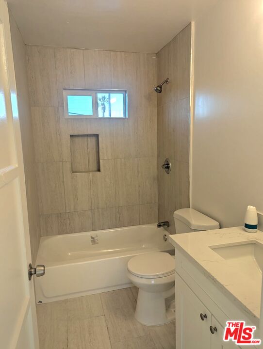 3841 Sedgwick Avenue Riverside, CA 92507 - Photo 4 of 10 a bathroom with a sink a toilet and shower