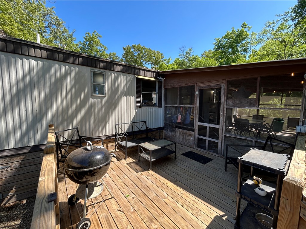 43 Sunset Cove Road Abbeville, SC 29620 - Photo 24 of 41 This spacious deck offers a seamless transition to a screened-in porch, ideal for outdoor gatherings.