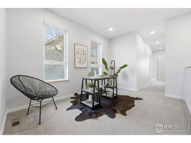 a view of a room with furniture and air hockey table