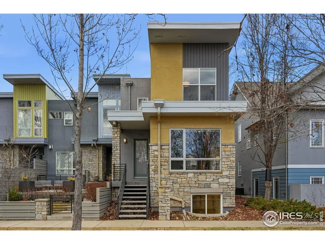 a front view of a building with glass windows
