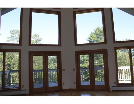 61 Falls Road Benton, ME 04901 - Photo 9 of 23 Living Room. Large wall of windows...