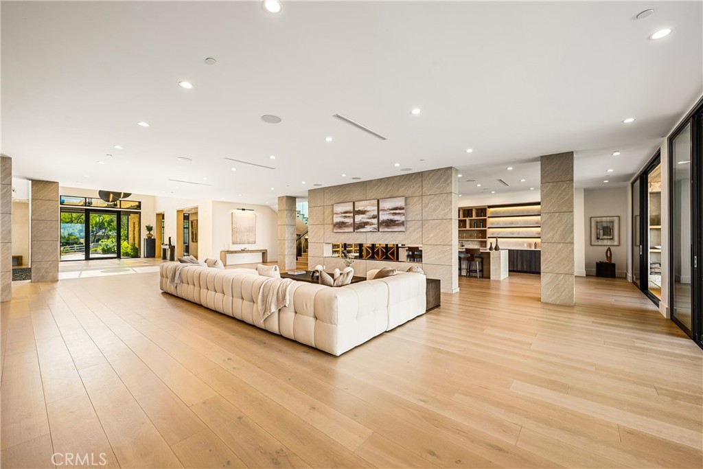 25079 Jim Bridger Road Hidden Hills, CA 91302 - Photo 14 of 73 a view of living room kitchen with stainless steel appliances kitchen island hardwood floor and living room view