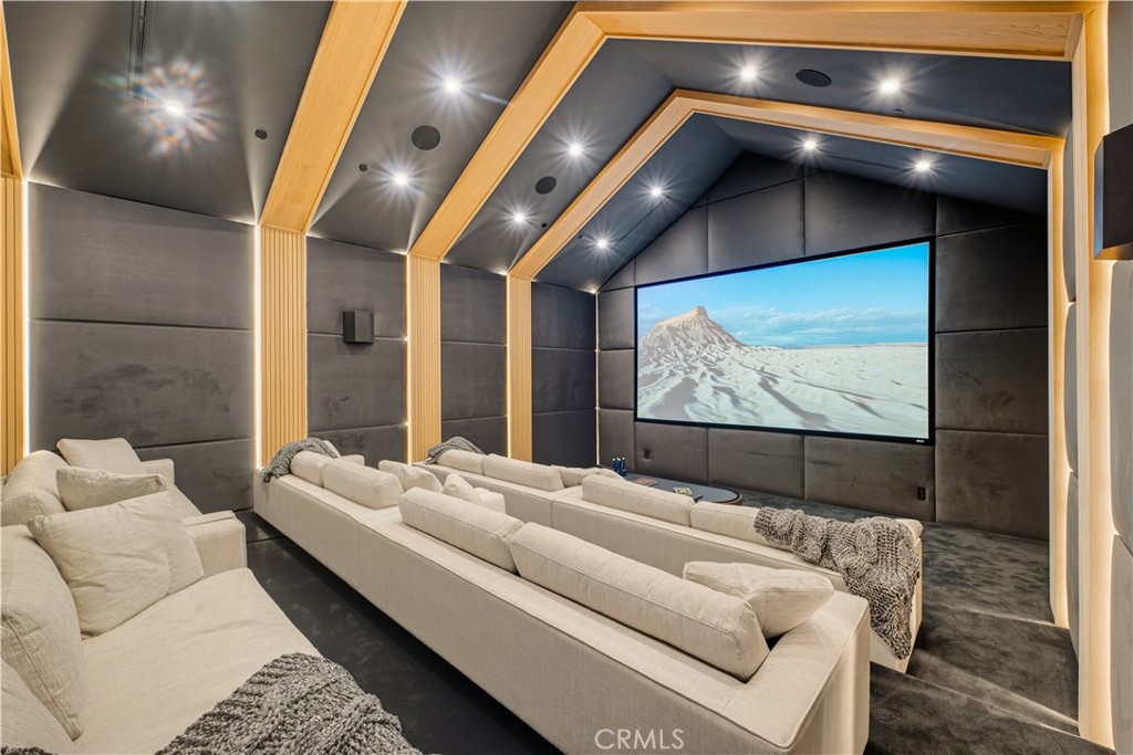 25079 Jim Bridger Road Hidden Hills, CA 91302 - Photo 35 of 73 a living room with furniture and a flat screen tv