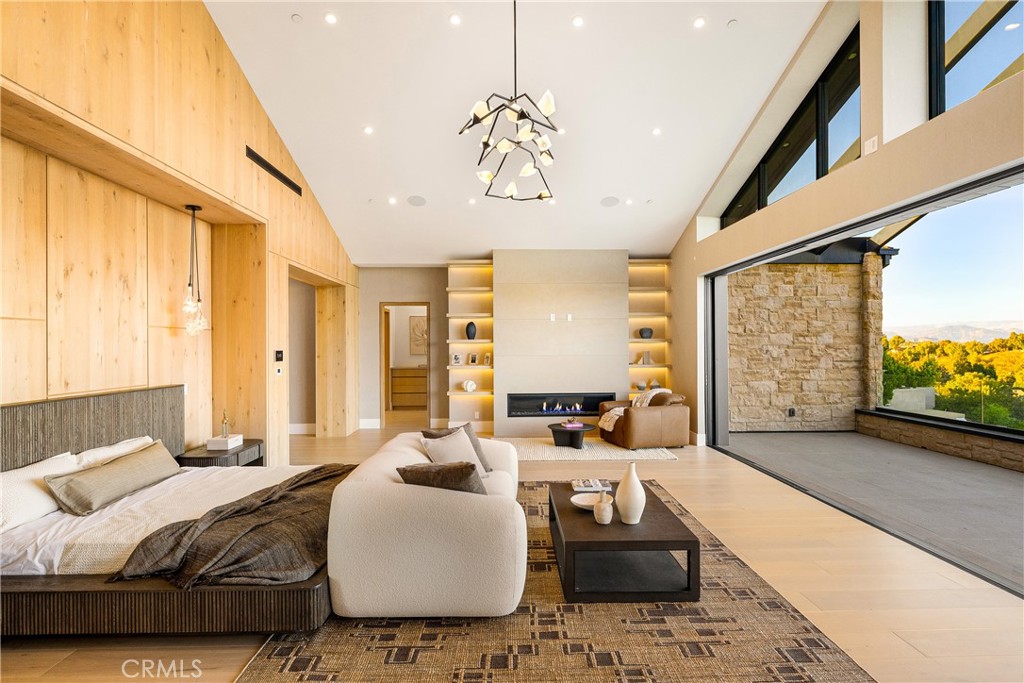 25079 Jim Bridger Road Hidden Hills, CA 91302 - Photo 53 of 73 a bedroom with a large bed and a large window