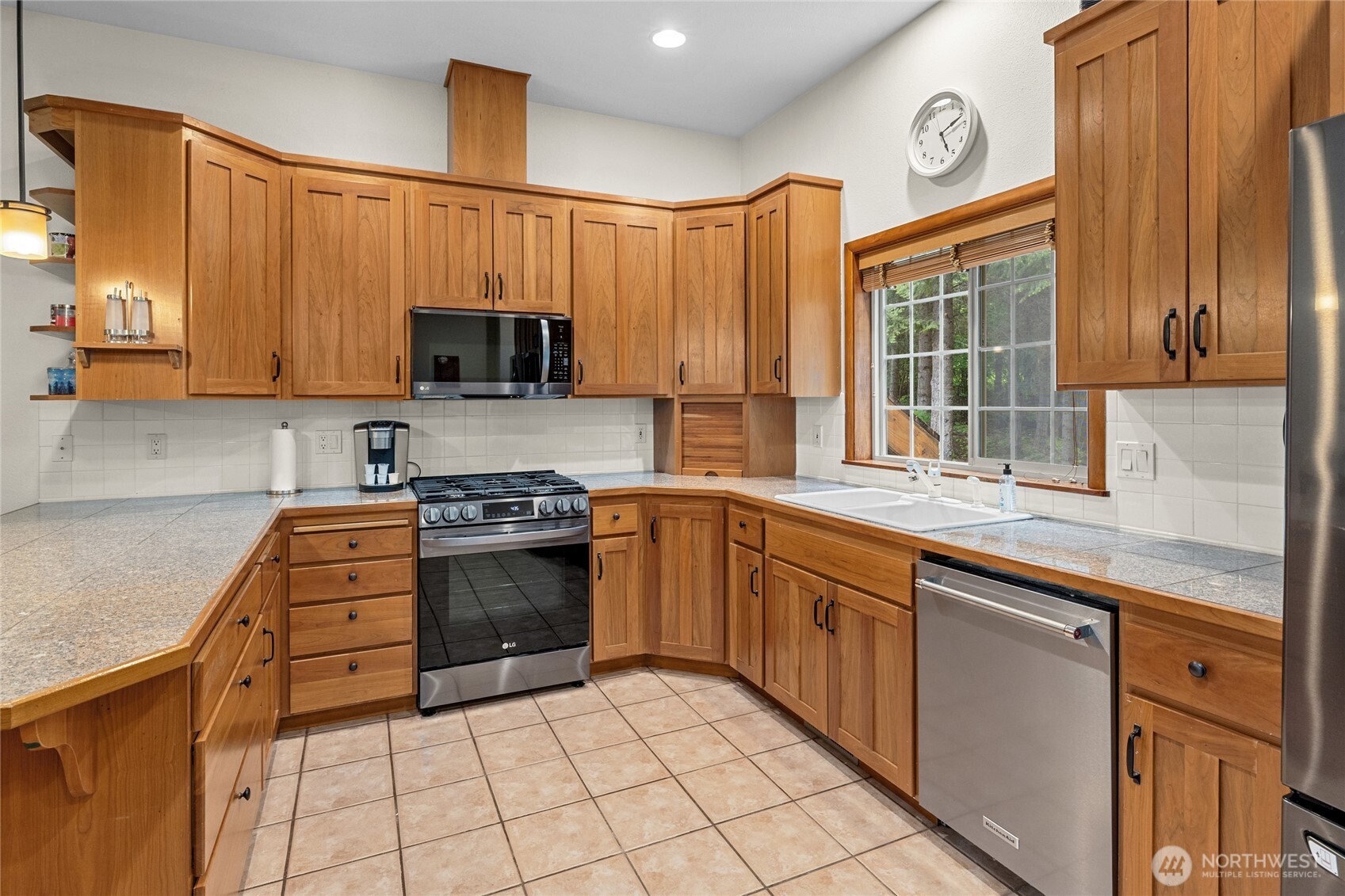 14997 Salmon La Sac Road Ronald, WA 98940 - Photo 18 of 39 a kitchen with stainless steel appliances granite countertop a stove a sink and a microwave