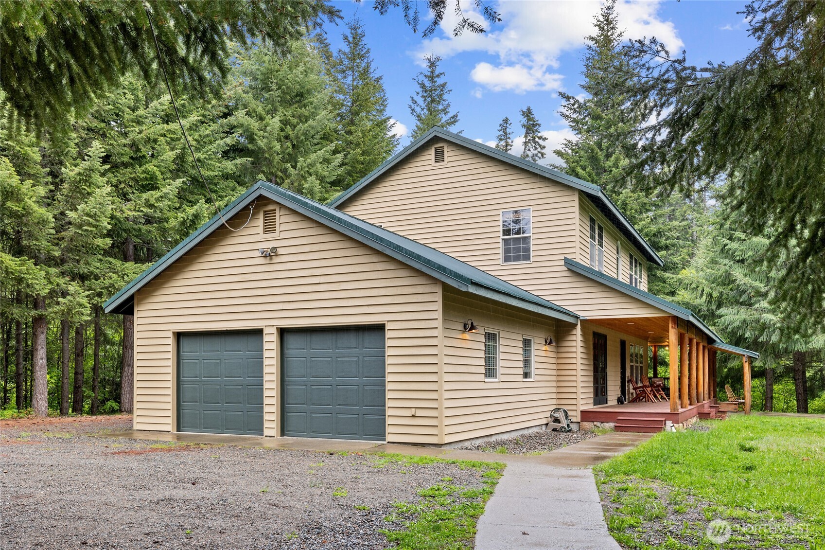 14997 Salmon La Sac Road Ronald, WA 98940 - Photo 36 of 39 a front view of a house with a yard and garage