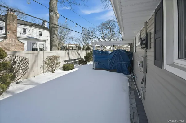 a view of a house with a snow in the background