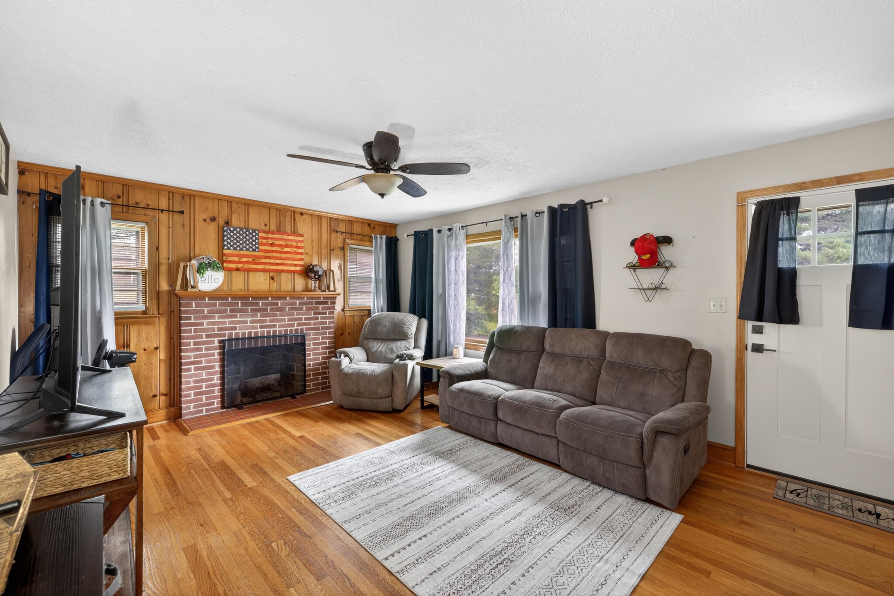 7827 Lee Highway Raphine, VA 24472 - Photo 10 of 62 a living room with furniture and a fireplace
