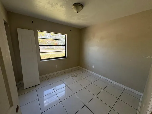 a view of an empty room and window