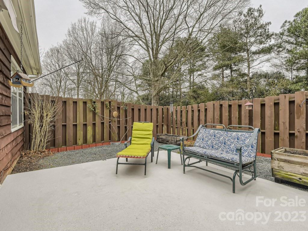 2500 Round Table Road, Unit B Monroe, NC 28110 - Photo 16 of 20 a view of patio with a bench and chairs