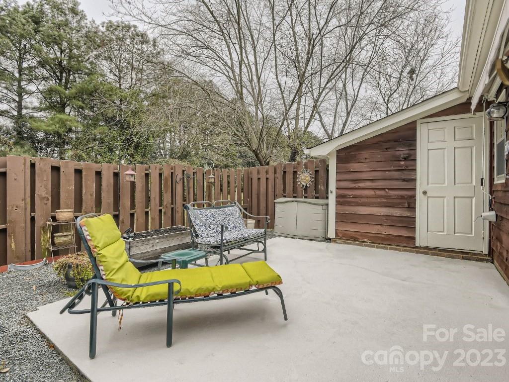 2500 Round Table Road, Unit B Monroe, NC 28110 - Photo 17 of 20 a view of backyard with a chair and table