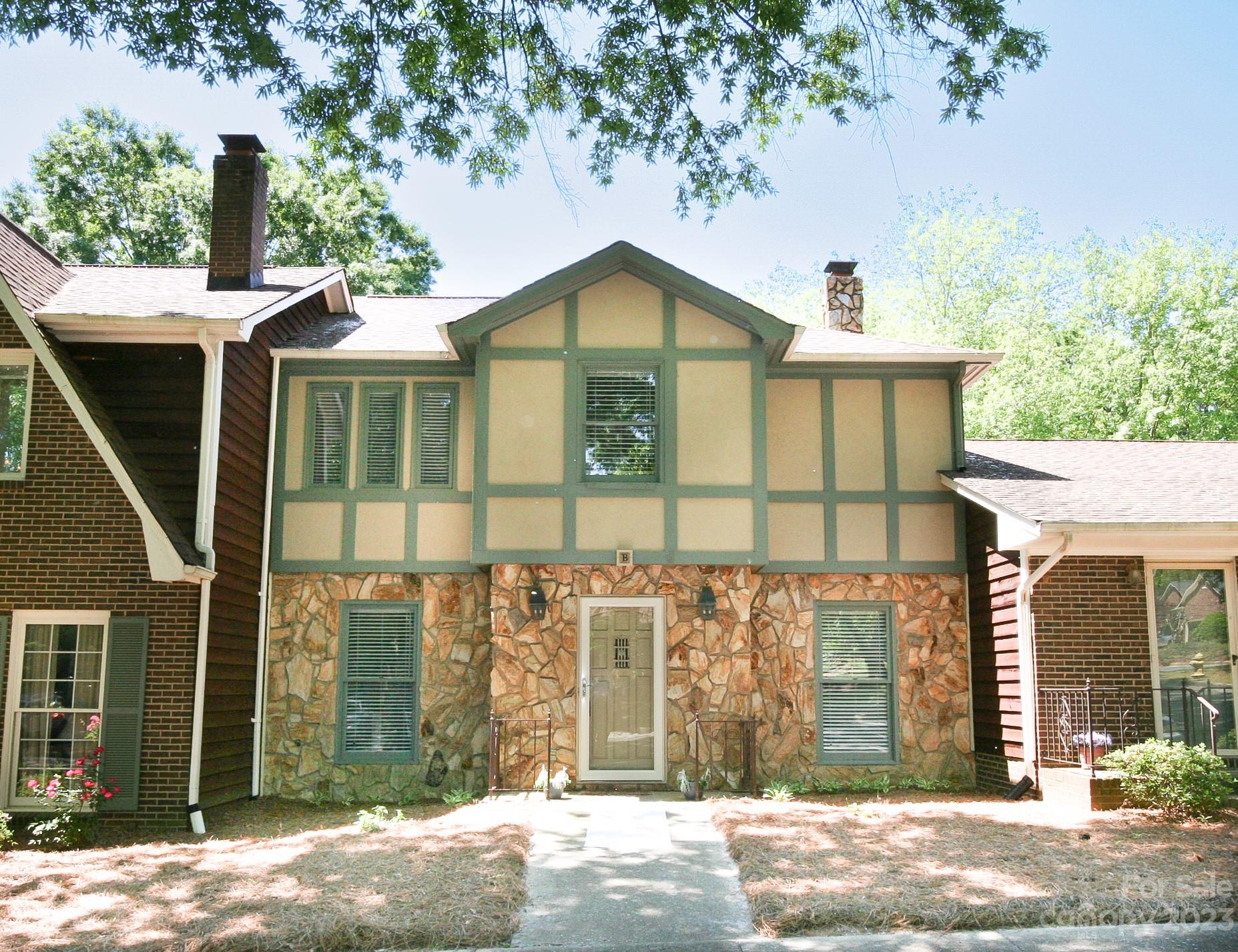 2500 Round Table Road, Unit B Monroe, NC 28110 - Photo 2 of 20 a front view of a house with a yard and garage