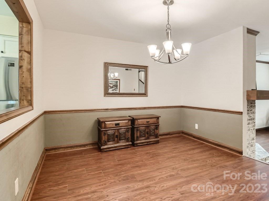 2500 Round Table Road, Unit B Monroe, NC 28110 - Photo 5 of 20 a view of a room with furniture and wooden floor