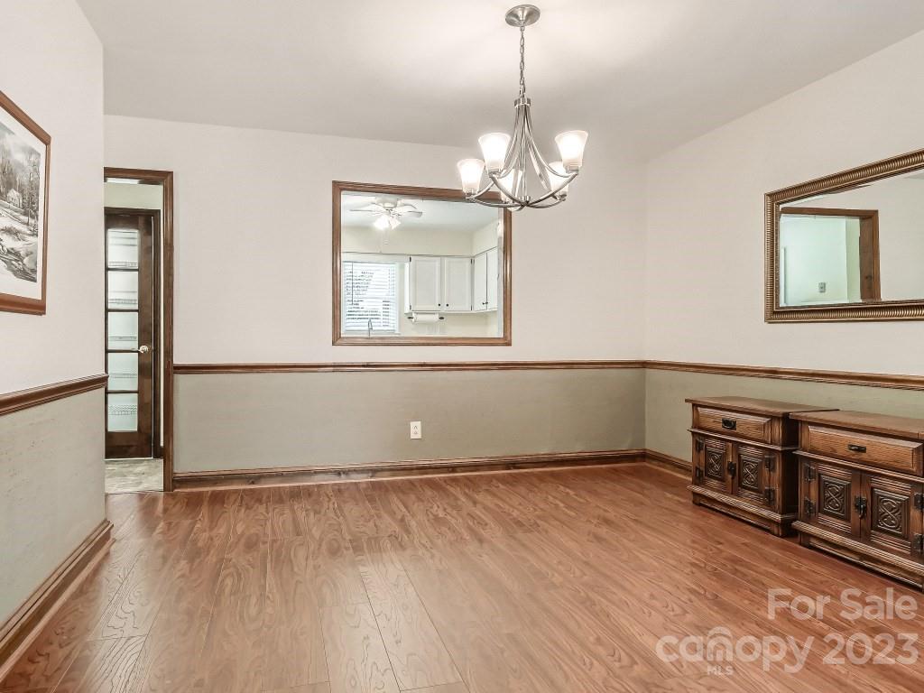 2500 Round Table Road, Unit B Monroe, NC 28110 - Photo 6 of 20 a view of empty room with wooden floor and window