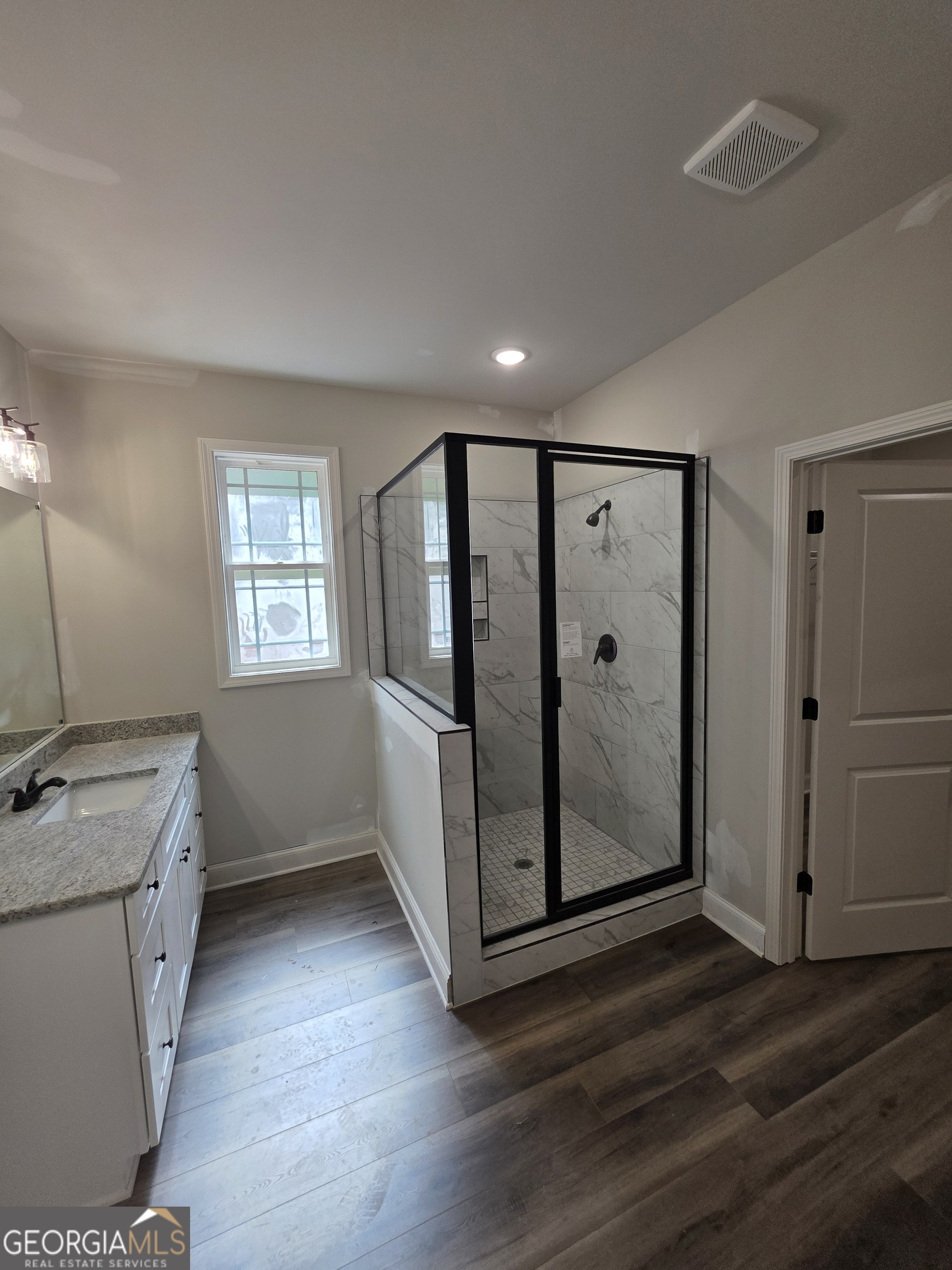 215 Panola Road Jackson, GA 30233 - Photo 9 of 16 a view of utility room with window and wooden floor