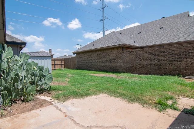 a backyard of a house with lots of green space