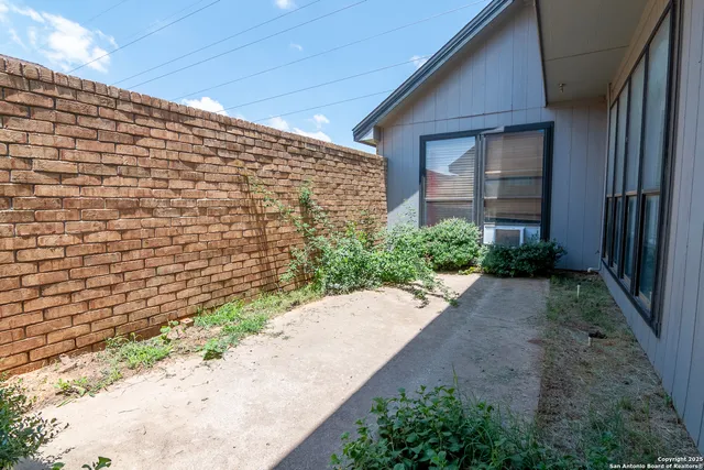 a view of a pathway both side of house