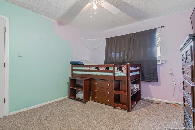 a room with a bed and a chair