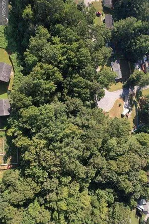 a view of a house with a tree