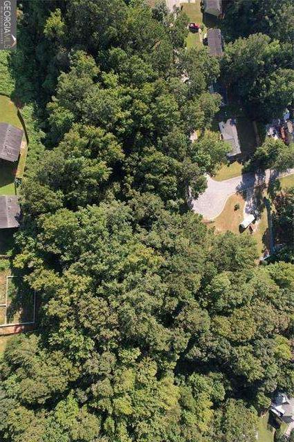 9142 Ford Street Southwest Covington, GA 30014 - Photo 1 of 15 a view of a house with a tree