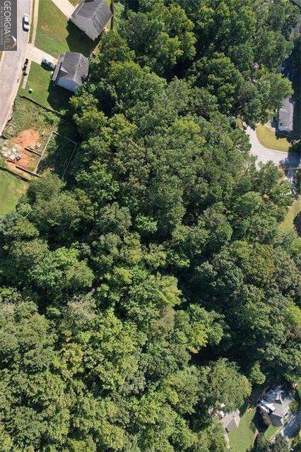 9142 Ford Street Southwest Covington, GA 30014 - Photo 7 of 15 an aerial view of residential house with outdoor space and trees all around