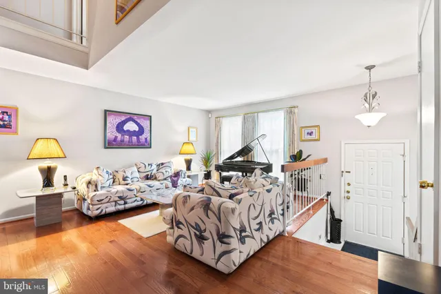 a bedroom with furniture and a wooden floor