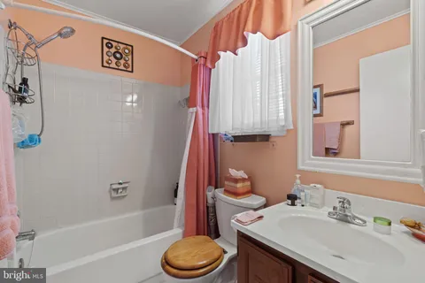 a bathroom with a sink a toilet and a bathtub