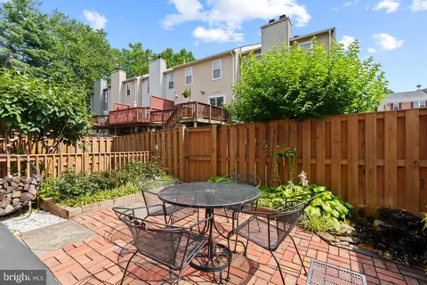a view of a chairs and table in a patio