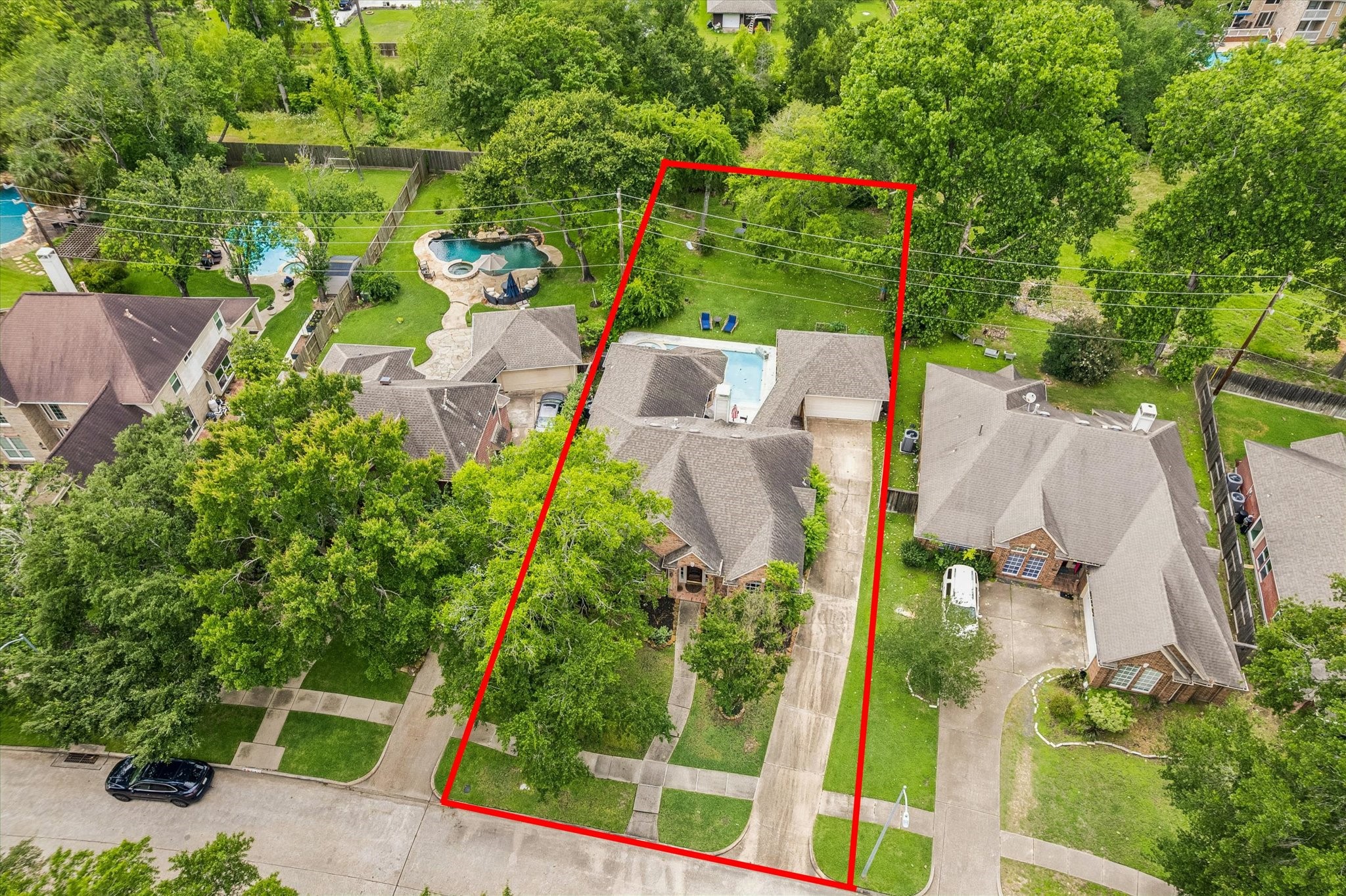 9110 Rhapsody Lane Houston, TX 77040 - Photo 18 of 20 An expansive 20,000 plus lot with no back neighbors and access to the bayou. Property line extends further than the fence. You may reference the survey for verification.
