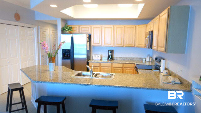27800 Canal Road, Unit 214 Orange Beach, AL 36561 - Photo 4 of 6 Granite, SS appliances, Ceramic Tile floors in spacious kitchen with ample cabinets and raised ceiling!