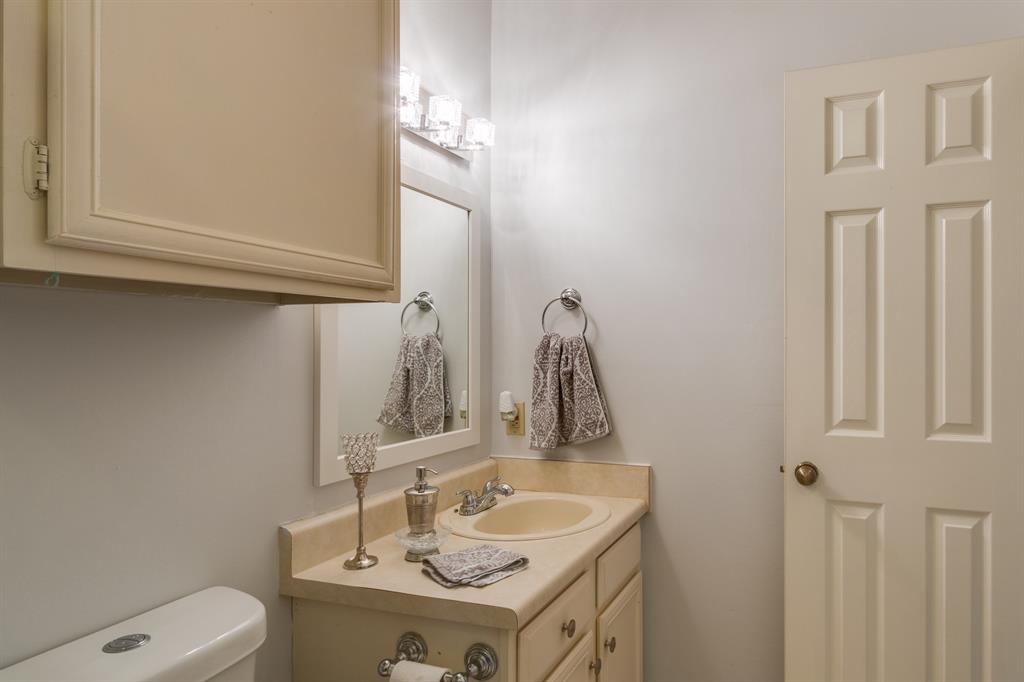 2100 Randy Snow Road, Unit 412 Arlington, TX 76011 - Photo 18 of 32 a bathroom with a sink vanity and toilet