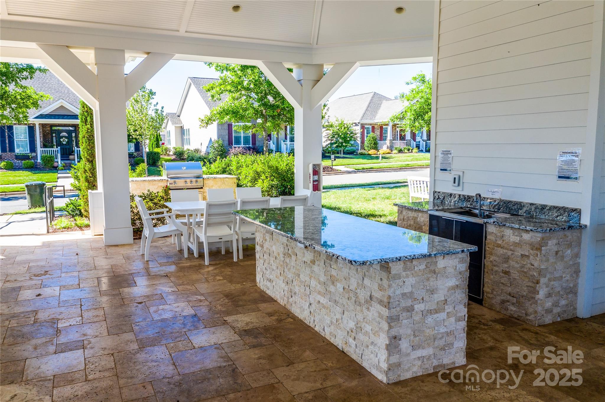 12821 Mayes Road Huntersville, NC 28078 - Photo 13 of 17 a view of a patio with table and chairs potted plants and floor to ceiling window