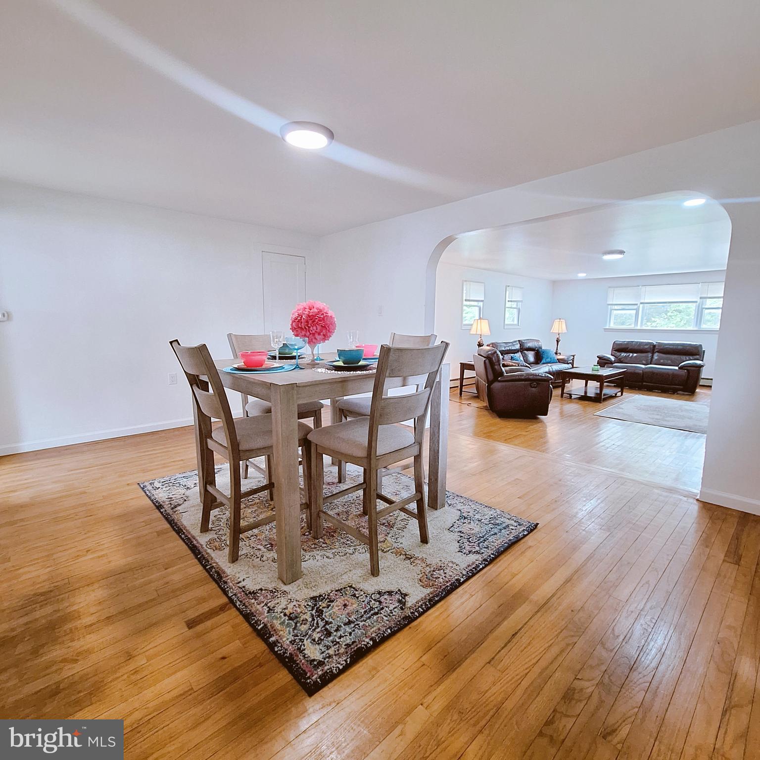 734 Pulaski Highway Bear, DE 19701 - Photo 11 of 20 a dining room with furniture and wooden floor