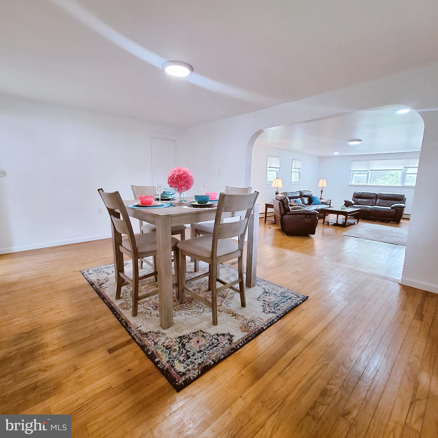 734 Pulaski Highway Bear, DE 19701 - Photo 12 of 20 a dining room with furniture and wooden floor