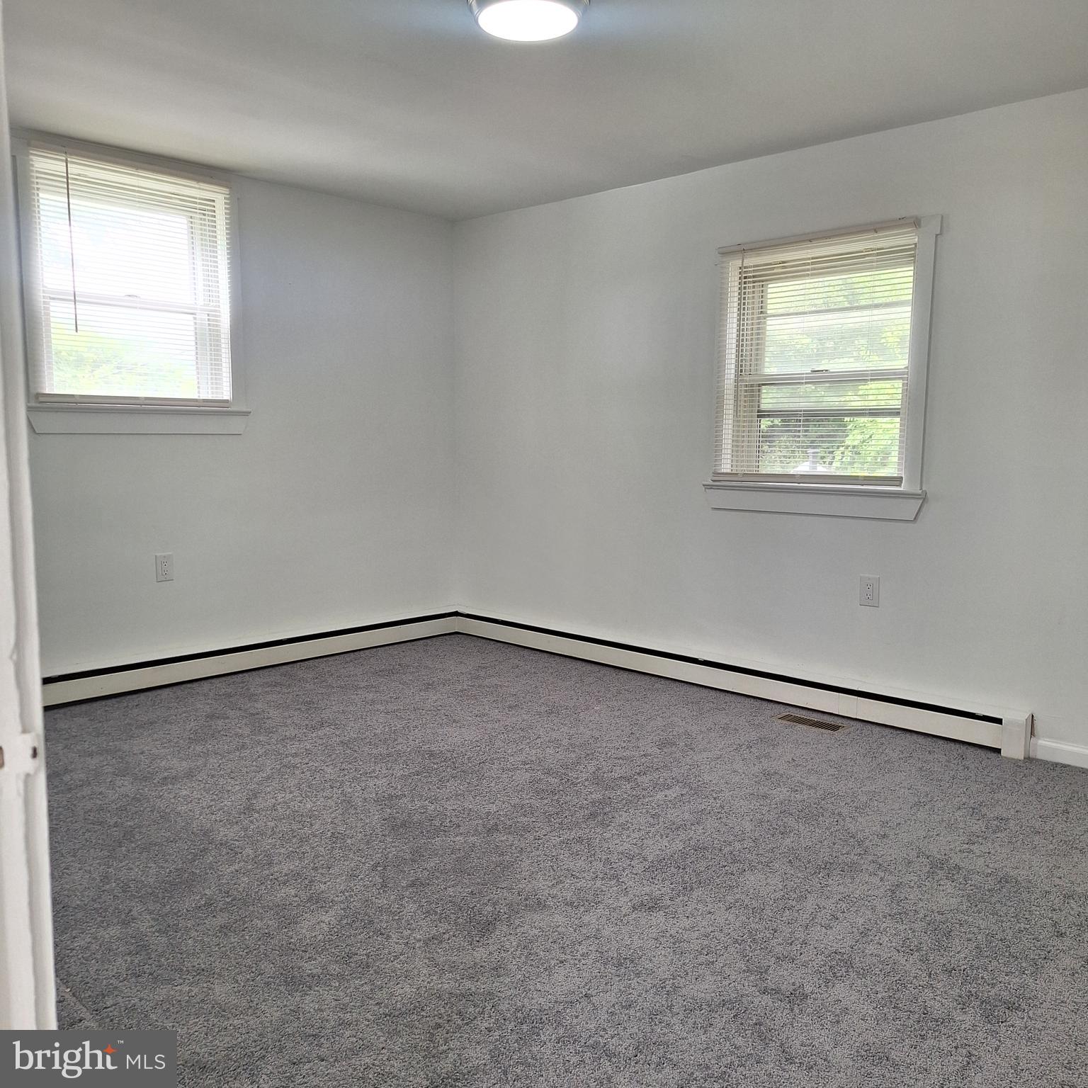 734 Pulaski Highway Bear, DE 19701 - Photo 14 of 20 an empty room with a window