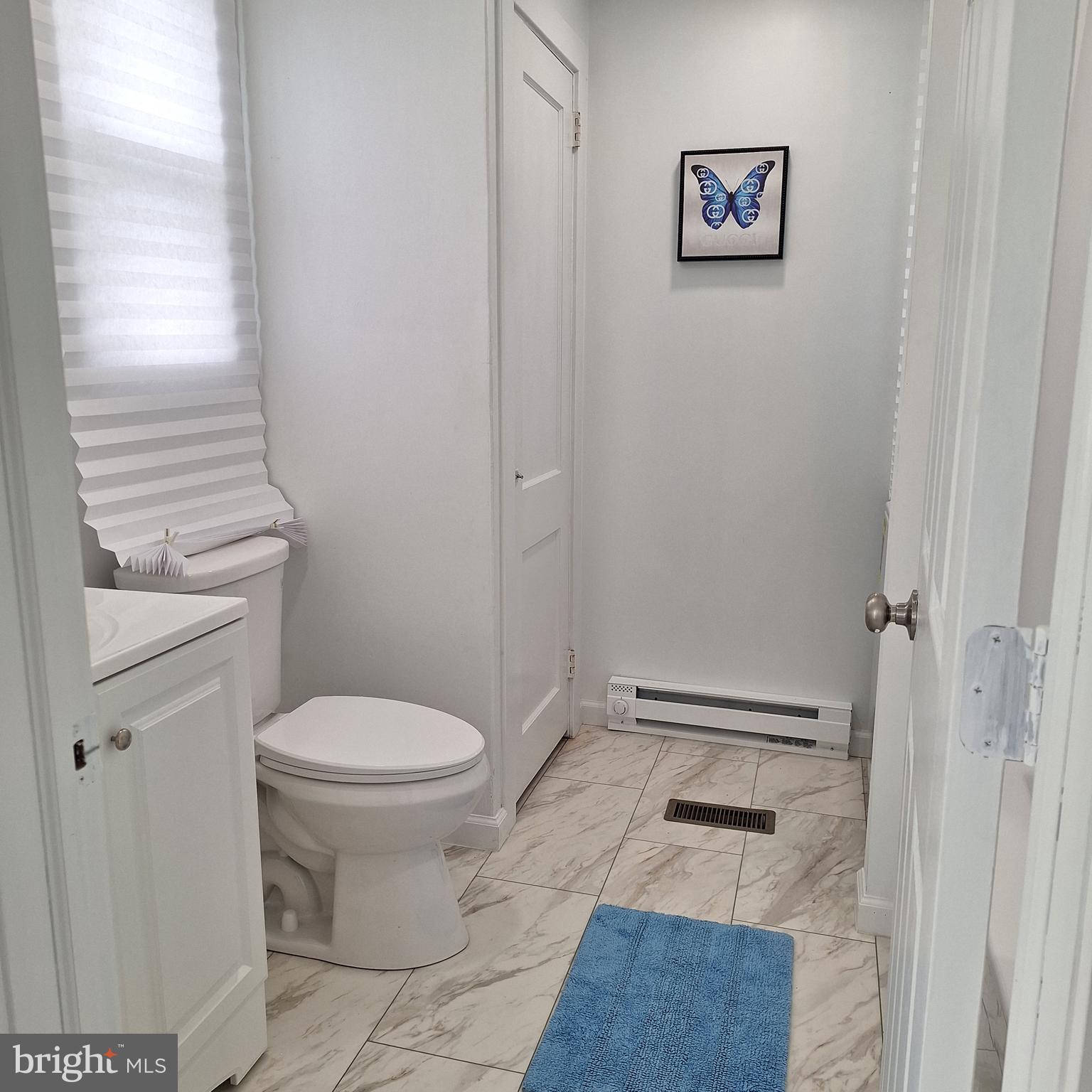 734 Pulaski Highway Bear, DE 19701 - Photo 15 of 20 a bathroom with a toilet and a shower