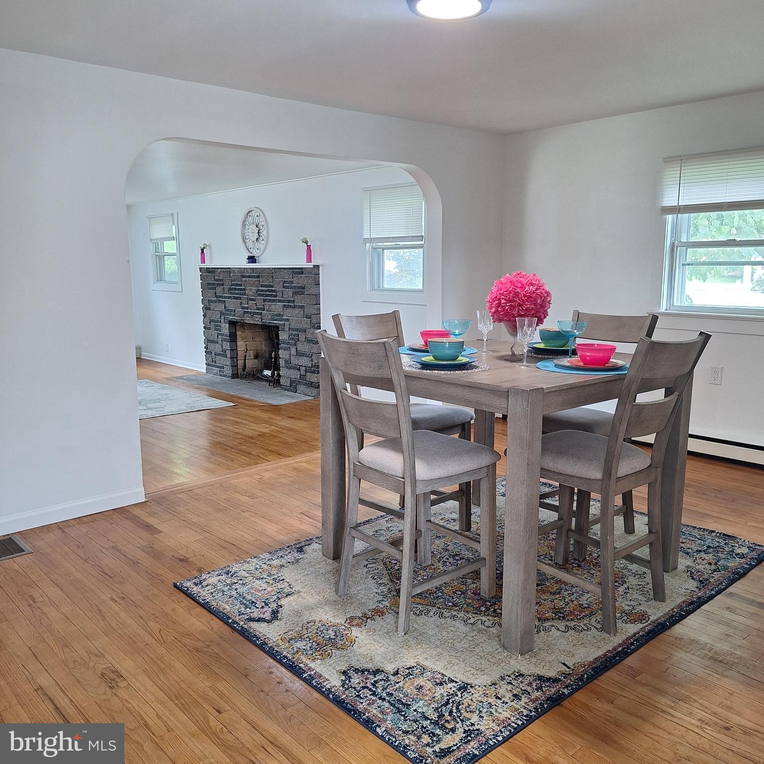 734 Pulaski Highway Bear, DE 19701 - Photo 3 of 20 a view of a dining room with furniture and wooden floor
