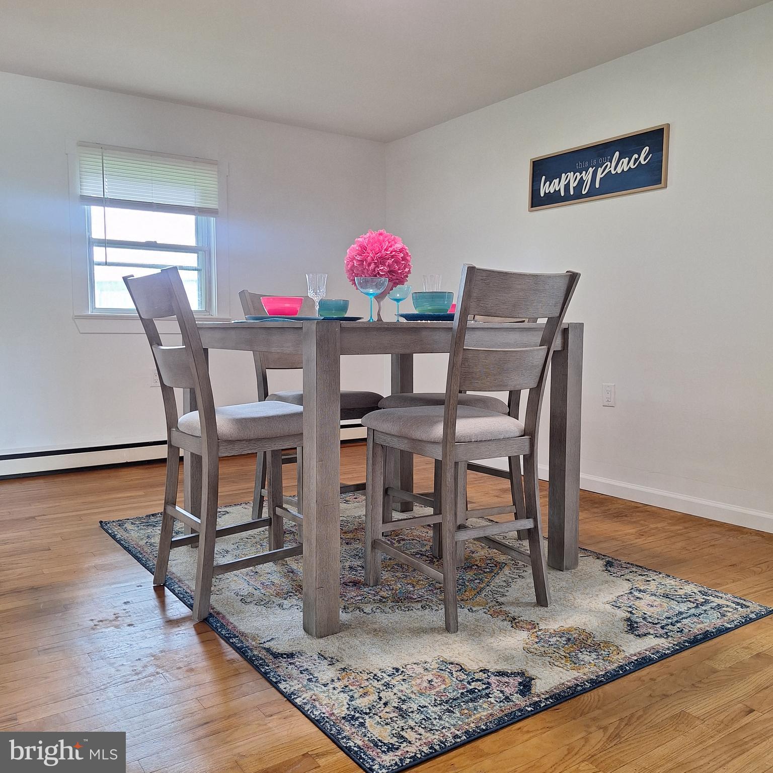 734 Pulaski Highway Bear, DE 19701 - Photo 4 of 20 a view of a dining room with furniture and wooden floor